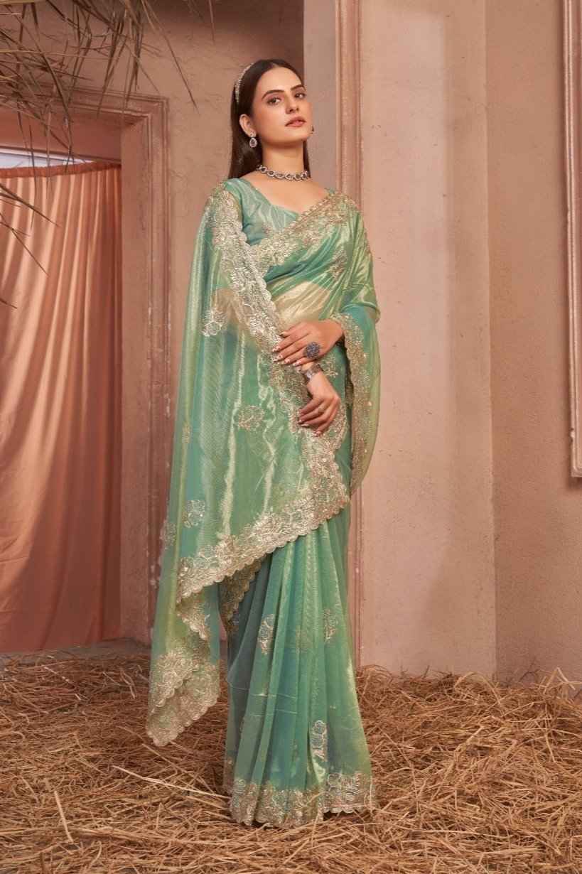 Chic Shimmer Net Saree Adorned with Swarovski Stones and Embroidered Patterns