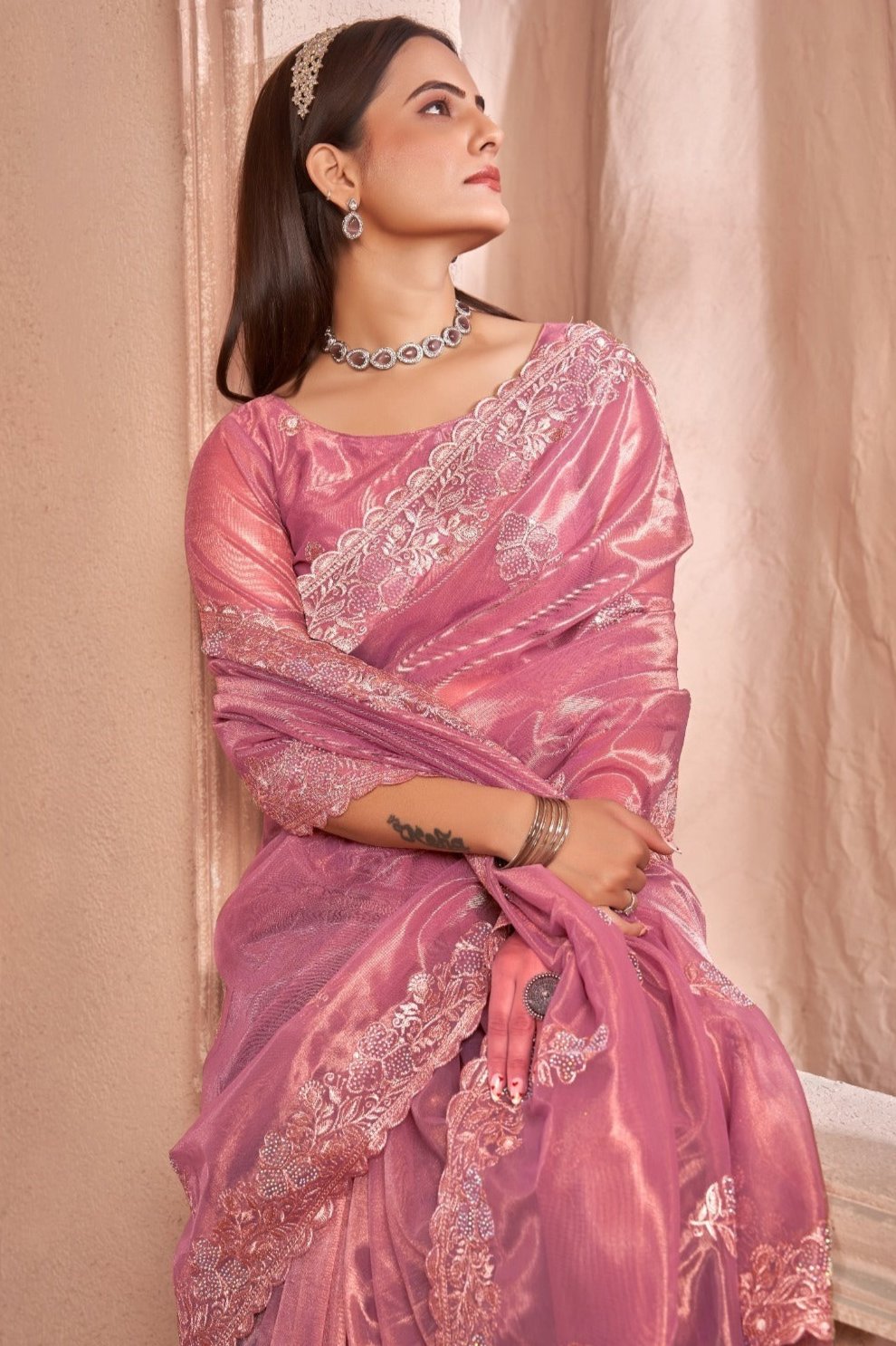 Chic Shimmer Net Saree Adorned with Swarovski Stones and Embroidered Patterns