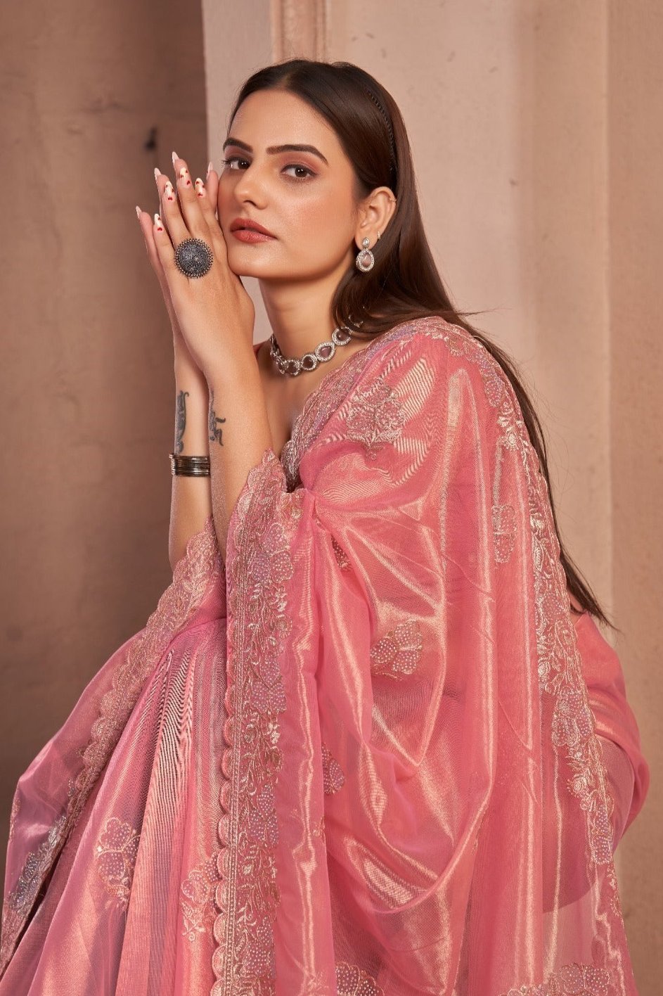 Chic Shimmer Net Saree Adorned with Swarovski Stones and Embroidered Patterns