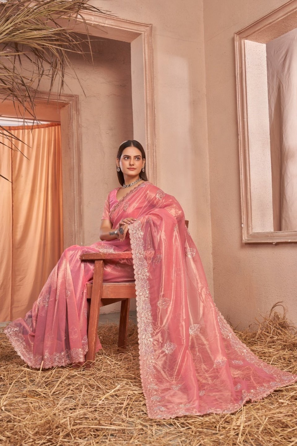 Chic Shimmer Net Saree Adorned with Swarovski Stones and Embroidered Patterns